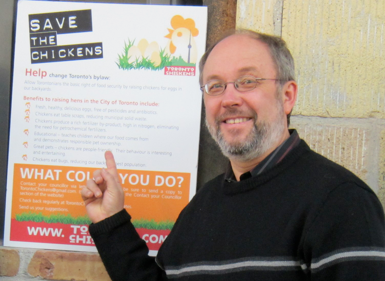 Councillor Joe Mihevc helping to ‘save the chickens’